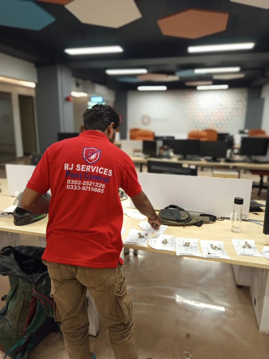 Rana Jees Fumigation Services technician preparing treatment at an office