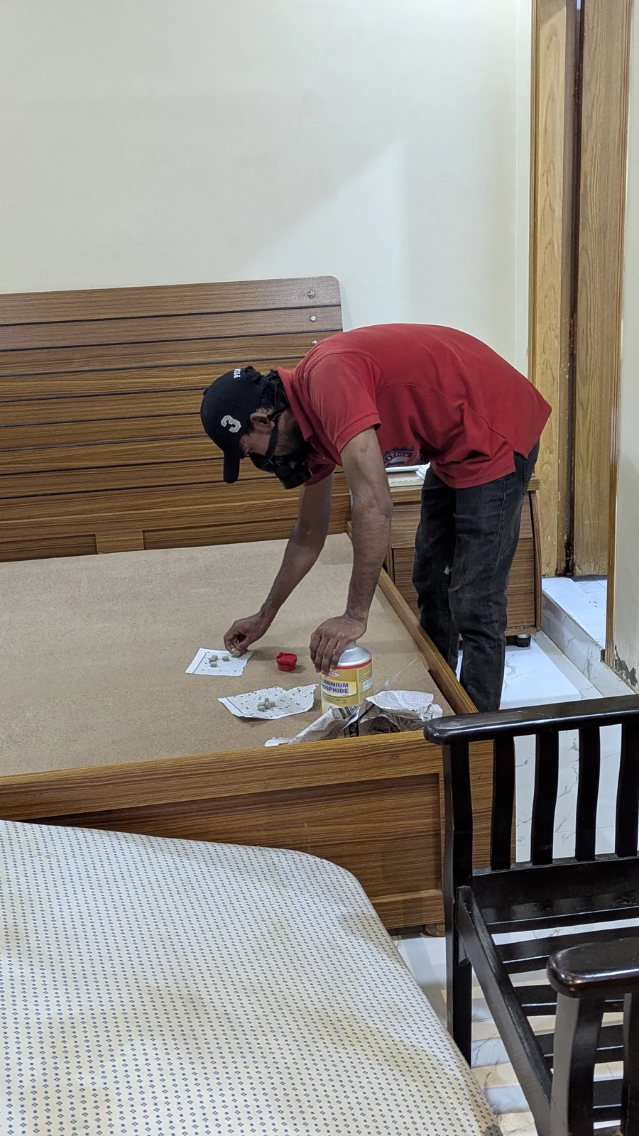 Rana Jees Fumigation Services team member preparing a bedroom service