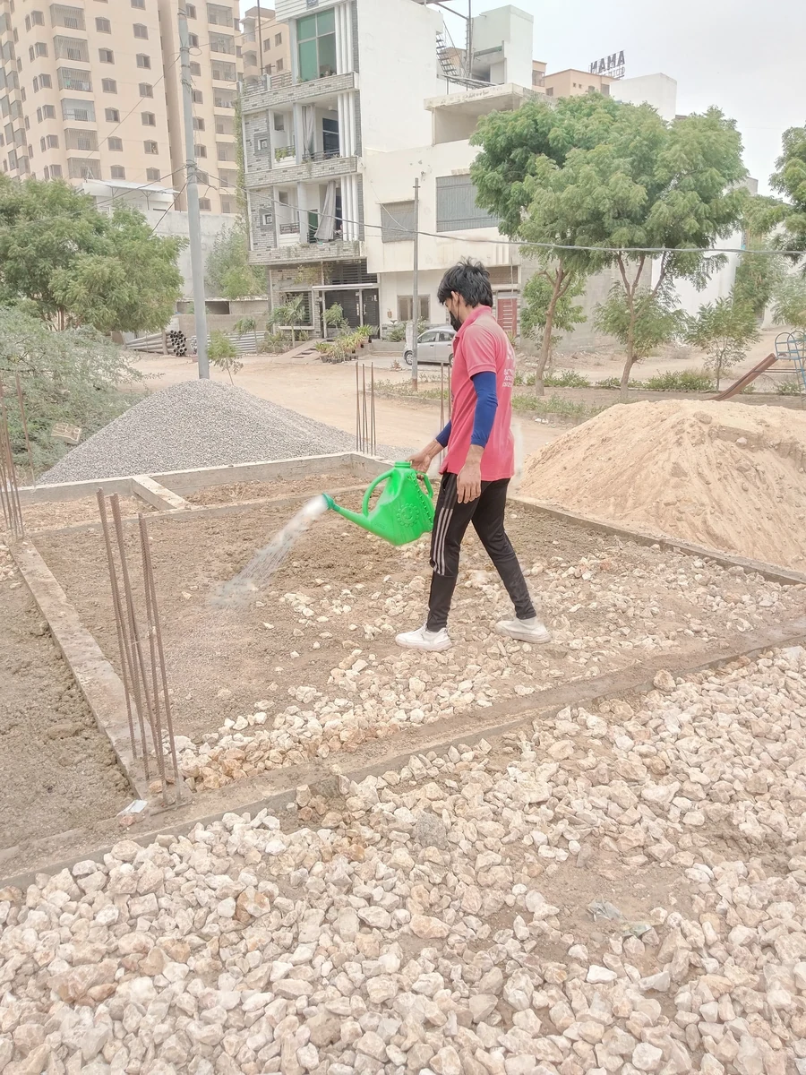 Rana Jees Fumigation Services technician treating a construction-site foundation
